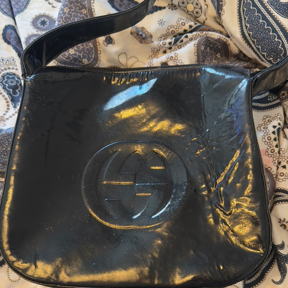Gucci Black Shoulder Bag with Gold Accents and Interlocking GG Logo